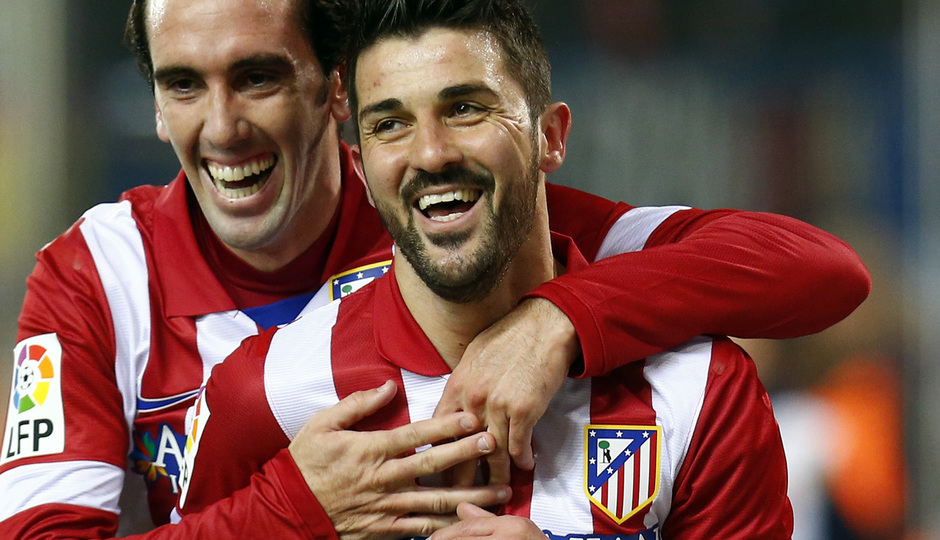 Temporada 13/14 Liga BBVA Atlético de Madrid - Sevilla. Abrazo de Godín con David Villa tras el gol.