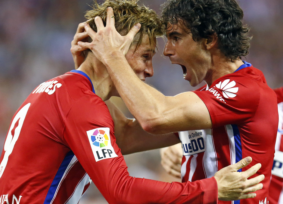 temporada 15/16. Partido Atlético de Madrid Barcelona. Tiago y Torres celebrando durante el partido
